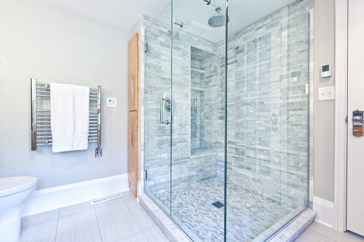 Large glass walk-in shower with tiled interior in a Tub-to-Shower Conversion in Mint Hill, NC.